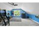 Blue bedroom with a bunk bed, large window, and a colorful rug creating a fun atmosphere at 7116 Incline Dr, Wake Forest, NC 27587