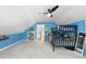 Bright bedroom featuring a bunk bed, blue walls, and a ceiling fan at 7116 Incline Dr, Wake Forest, NC 27587
