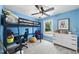 A cozy bedroom with a modern loft bed, desk, and ample natural light at 7116 Incline Dr, Wake Forest, NC 27587