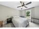 Neutral bedroom with a comfortable bed, soft lighting, and a view of the outdoors at 7116 Incline Dr, Wake Forest, NC 27587
