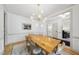 Elegant dining room with a wooden table, stylish chandelier, and neutral color palette at 7116 Incline Dr, Wake Forest, NC 27587