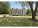 Charming two-story home with a well-maintained lawn, beautiful landscaping, and a welcoming entryway at 7116 Incline Dr, Wake Forest, NC 27587