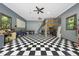 Large garage with a checkerboard floor, offering flexible space for storage and activities at 7116 Incline Dr, Wake Forest, NC 27587