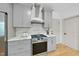 Kitchen showcasing modern gray cabinets, stainless steel appliances and stone countertops and backsplash at 7116 Incline Dr, Wake Forest, NC 27587
