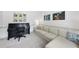 Cozy living room with comfortable seating, large windows, and a black piano, perfect for relaxation at 7116 Incline Dr, Wake Forest, NC 27587