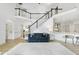 Spacious living room with staircase, high ceilings, and easy access to the kitchen area at 7116 Incline Dr, Wake Forest, NC 27587