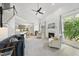 Bright living room with fireplace, vaulted ceiling, and seamless transition to kitchen at 7116 Incline Dr, Wake Forest, NC 27587