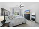 Spacious main bedroom with vaulted ceiling, ceiling fan, TV, and views of the backyard at 7116 Incline Dr, Wake Forest, NC 27587