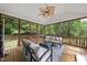 Relaxing screened porch with comfortable seating and a view of the outdoors at 7116 Incline Dr, Wake Forest, NC 27587