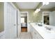 This bathroom has a double sink vanity and access to another room with a door left open to the bedroom at 74 Pedernales Dr, Smithfield, NC 27577