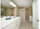 Bright bathroom featuring a double vanity, framed mirror and a large walk-in tiled shower at 74 Pedernales Dr, Smithfield, NC 27577
