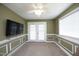 Bonus room with crown molding, ceiling fan, and French doors to the backyard at 74 Pedernales Dr, Smithfield, NC 27577