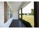 Picture of the covered front porch featuring a painted wooden floor and traditional posts at 74 Pedernales Dr, Smithfield, NC 27577