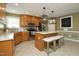 Bright kitchen with island, pendant lighting, stainless appliances and bar stool seating at 74 Pedernales Dr, Smithfield, NC 27577