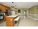 Updated kitchen with island seating, stainless appliances, and an adjoining dining area at 74 Pedernales Dr, Smithfield, NC 27577