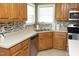 Spacious kitchen with stainless appliances, tile backsplash, and ample cabinet space at 74 Pedernales Dr, Smithfield, NC 27577