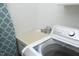 Close up of laundry sink with modern faucet and updated LG washing machine at 74 Pedernales Dr, Smithfield, NC 27577