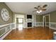 Open-concept living room showcasing hardwood floors, fireplace, and an open doorway at 74 Pedernales Dr, Smithfield, NC 27577