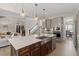 Spacious kitchen island featuring a sink, dishwasher, and stainless steel appliances at 7729 Calcutta Dr, Willow Springs, NC 27592