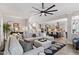 Spacious living room with a comfortable sectional sofa and open access to the kitchen area at 7729 Calcutta Dr, Willow Springs, NC 27592