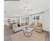 Inviting living room boasts large windows, neutral colors and plush seating, creating a cozy and modern atmosphere at 85 Cordoba Dr, Franklinton, NC 27525