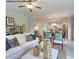 Comfortable living room with ample seating, natural light and seamless transition into the dining area and kitchen at 85 Cordoba Dr, Franklinton, NC 27525