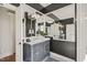 Bathroom with a vanity, marble countertop and decorative mirrors at 8524 Society Pl, Raleigh, NC 27615