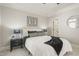 Beautifully decorated bedroom with a queen bed, neutral color palette, and an adjacent walk-in closet at 8524 Society Pl, Raleigh, NC 27615