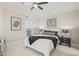 Well-lit bedroom with a plush bed, stylish decor, and balcony access, offering a serene retreat at 8524 Society Pl, Raleigh, NC 27615