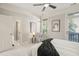Bright bedroom with a ceiling fan, chair, and balcony at 8524 Society Pl, Raleigh, NC 27615