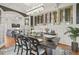 Formal dining room featuring a stylish chandelier, wine rack, and view to living space at 8524 Society Pl, Raleigh, NC 27615