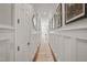 Hallway with paneled walls and hardwood floors at 8524 Society Pl, Raleigh, NC 27615