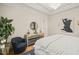 Main bedroom with a mirrored dresser and hardwood floors at 8524 Society Pl, Raleigh, NC 27615