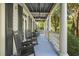 Inviting porch with rocking chairs, offering a relaxing outdoor space with natural light at 8524 Society Pl, Raleigh, NC 27615