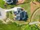 Aerial view of a large modern home with a circular driveway on a large lot at 9004 Meadow Pointe Ct, Wake Forest, NC 27587