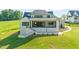 Expansive backyard with a covered patio and stairs to the upper level at 9004 Meadow Pointe Ct, Wake Forest, NC 27587