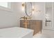 Close up on primary bathroom with modern vanity, soaker tub, and gold fixtures at 9004 Meadow Pointe Ct, Wake Forest, NC 27587