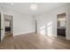 Spacious bedroom with hardwood flooring and multiple doorways at 9004 Meadow Pointe Ct, Wake Forest, NC 27587