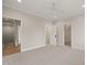 Spacious bedroom with neutral carpet, multiple closets, and recessed lighting at 9004 Meadow Pointe Ct, Wake Forest, NC 27587