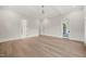 Large bedroom with hardwood floors and multiple doors leading to the bathroom and patio at 9004 Meadow Pointe Ct, Wake Forest, NC 27587