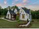 Beautiful home with a manicured lawn and professional landscaping at 9004 Meadow Pointe Ct, Wake Forest, NC 27587