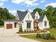 Beautiful modern home with an attached garage, dark roof, and professionally landscaped yard at 9004 Meadow Pointe Ct, Wake Forest, NC 27587