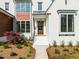Charming home entrance with professionally landscaped front yard and wooden front door at 9004 Meadow Pointe Ct, Wake Forest, NC 27587