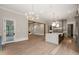 Open concept kitchen featuring chandelier lighting, an island with sink and stainless steel appliances at 9004 Meadow Pointe Ct, Wake Forest, NC 27587