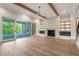 Spacious living room featuring a fireplace, wood beams and access to an outdoor patio at 9004 Meadow Pointe Ct, Wake Forest, NC 27587
