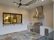Entertain in this outdoor kitchen featuring stainless steel appliances, a bar window, and a brick accent wall at 9004 Meadow Pointe Ct, Wake Forest, NC 27587