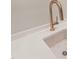 Close up shot of kitchen sink with rose gold hardware and decorative accent at 9004 Meadow Pointe Ct, Wake Forest, NC 27587