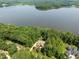 Beautiful home surrounded by trees with lake views, showcasing a peaceful residential setting at 901 Edgewater Dr, Garner, NC 27529