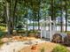 Beautiful backyard featuring a white pergola and scenic lake views at 901 Edgewater Dr, Garner, NC 27529