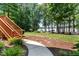 The backyard features a lakeside lawn and garden near wooden stairs at 901 Edgewater Dr, Garner, NC 27529